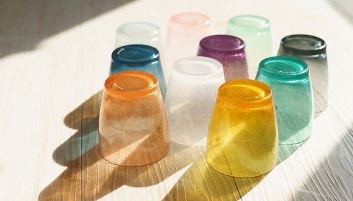 The colored glassware throw colorful shadow