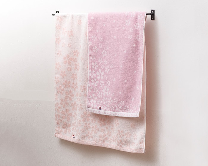 Floral towels Sakura Mon-Ori towel on a towel bar