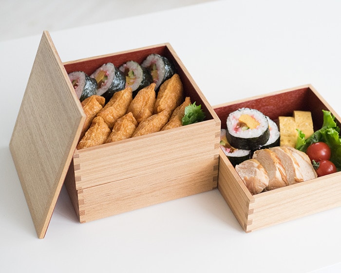 Sushi roll and Inari sushi in wooden Jubako box from Matsuya Shikkiten