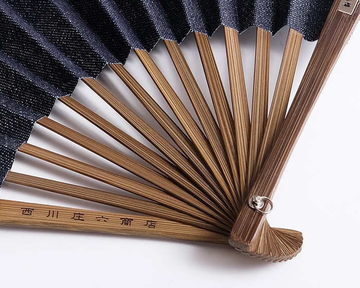 Brand name is engraved on guard of Japanese denim fan