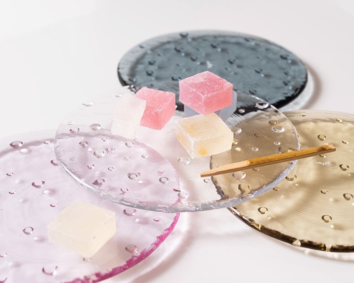 Japanese confectionery on piled glass plates droplet