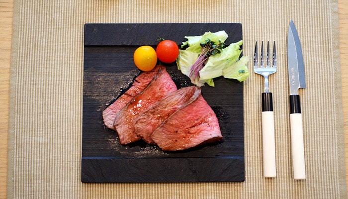 Roast beef on the black slate board