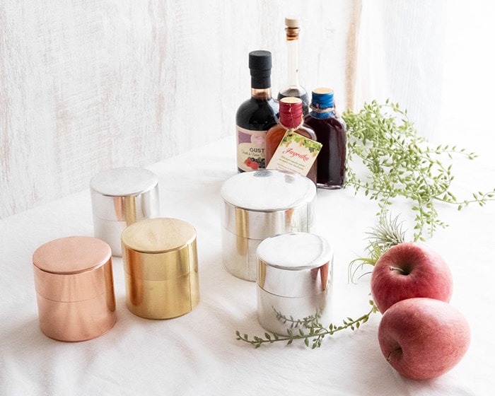 Copper, Brass, and Tin tea caddies with various items