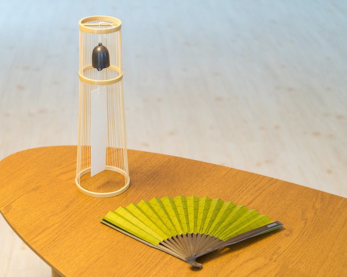 Tabletop wind bell and Japanese fan on the table